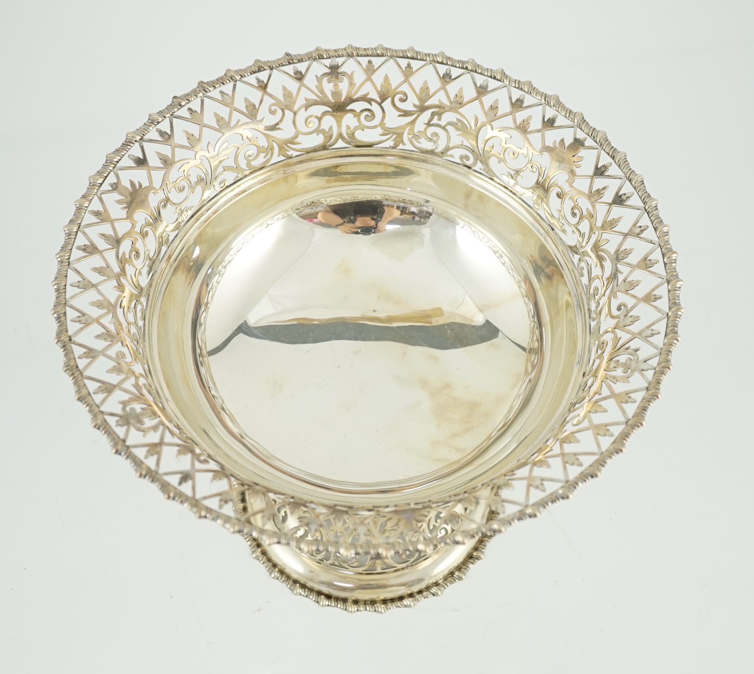 An Edwardian silver pedestal fruit bowl, with pierced border and pierced circular foot, by James Dixon & Sons